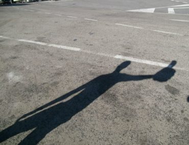 Shadow hitchhiking with foam thumb-Hitchhiking UK to Morocco